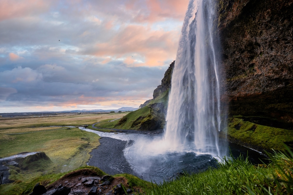 Stunning Seljalandsfoss Waterfall at Sunset, One of Iceland’s Most Popular and Breathtaking Natural Wonders