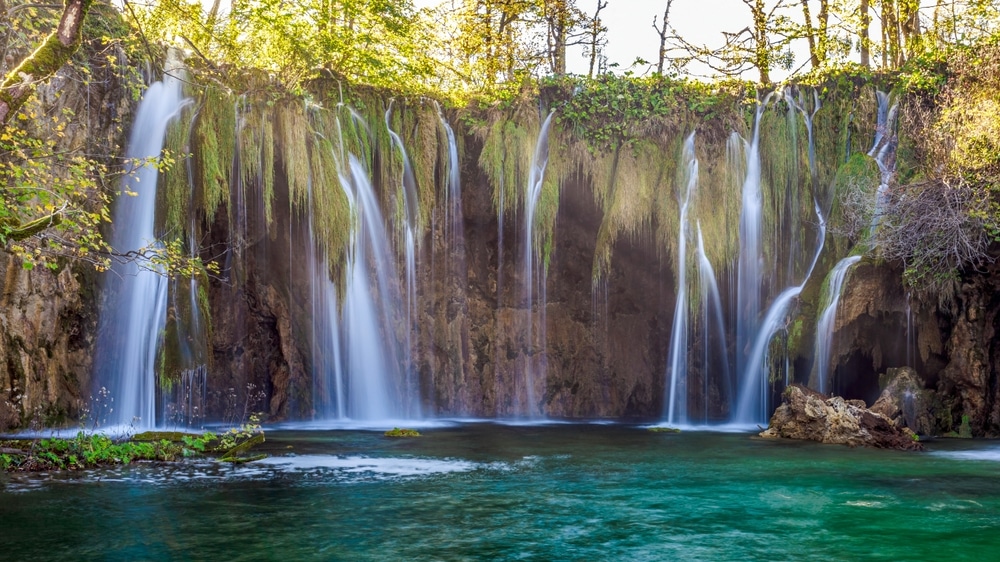 Waterfall’s scenery in the Plitvice lakes National Park during a sunny, autumn day.