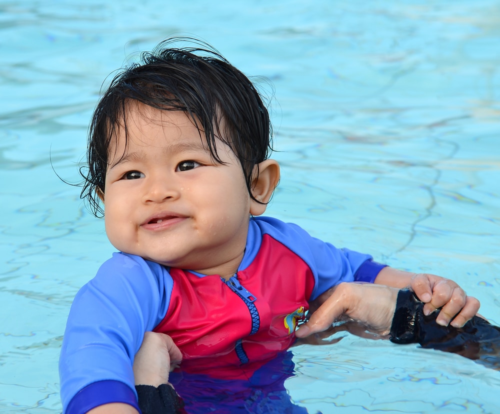 Cute Asian Baby Girl Enjoying And Smiling At Her First lesson