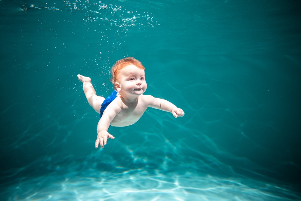 Cute Kid Dives in the Pool