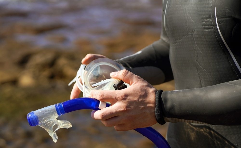 Hands Holding A Mask And Snorkeling Tube 