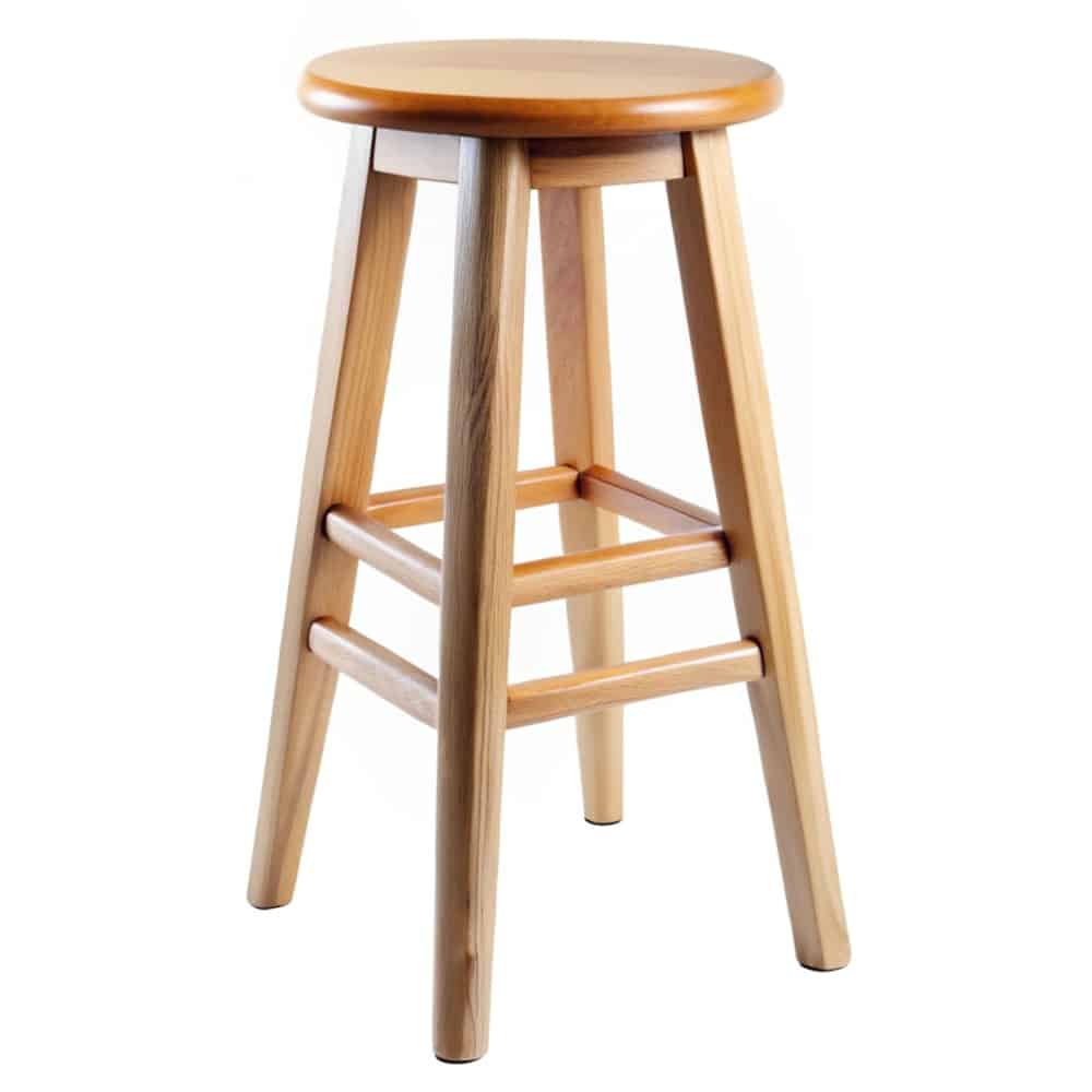 Simple wooden bar stool with a round seat on a plain white background